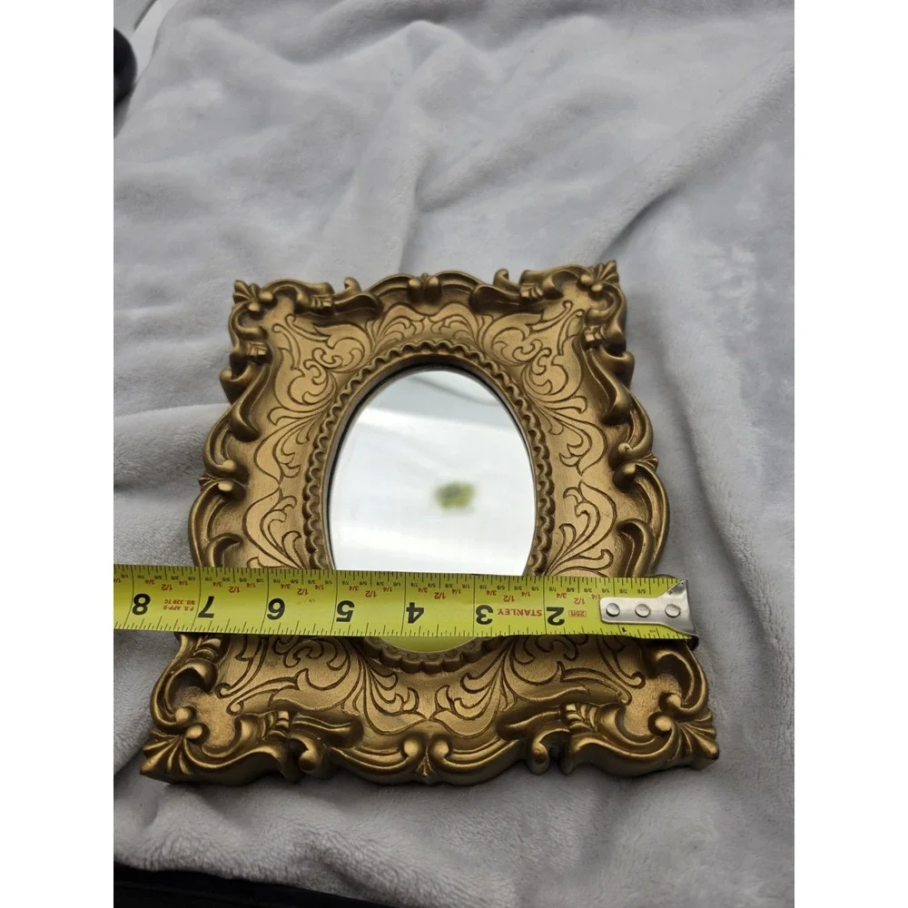Vintage Oval Mirror In An Ornate Gold Victorian/Hollywood Regency Plastic Frame